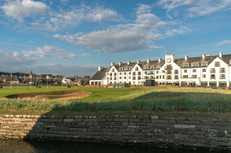 Carnoustie, Scotland - 29 September 2022: Alfred Dunhill Links Championship Round One at Carnoustie Golf Links, the 18th green and Carnoustie Golf Hotel basks in early evening autumnal sunshine